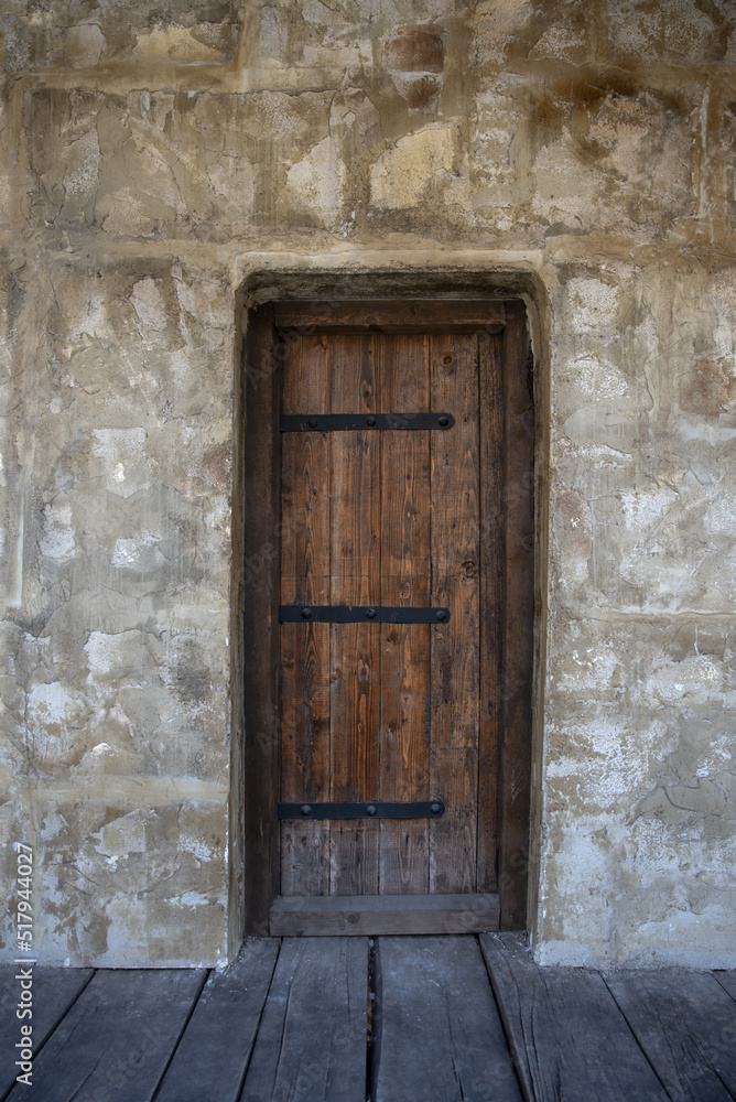 Big Old Wooden Door in The Castle Inside With Stone Wall