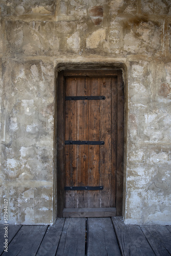 Big Old Wooden Door in The Castle Inside With Stone Wall