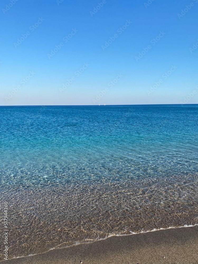 Crystal blue sea. Mediterranean Sea. Clean sea and sky. Greece. 