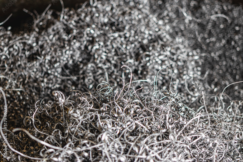 Metal shavings. Background. Waste after metal processing on a lathe.