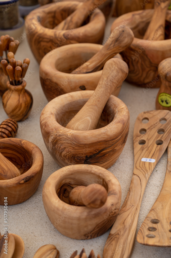 Craft works, olive tree wooden kitchen utensils on farmers market in Provence, France