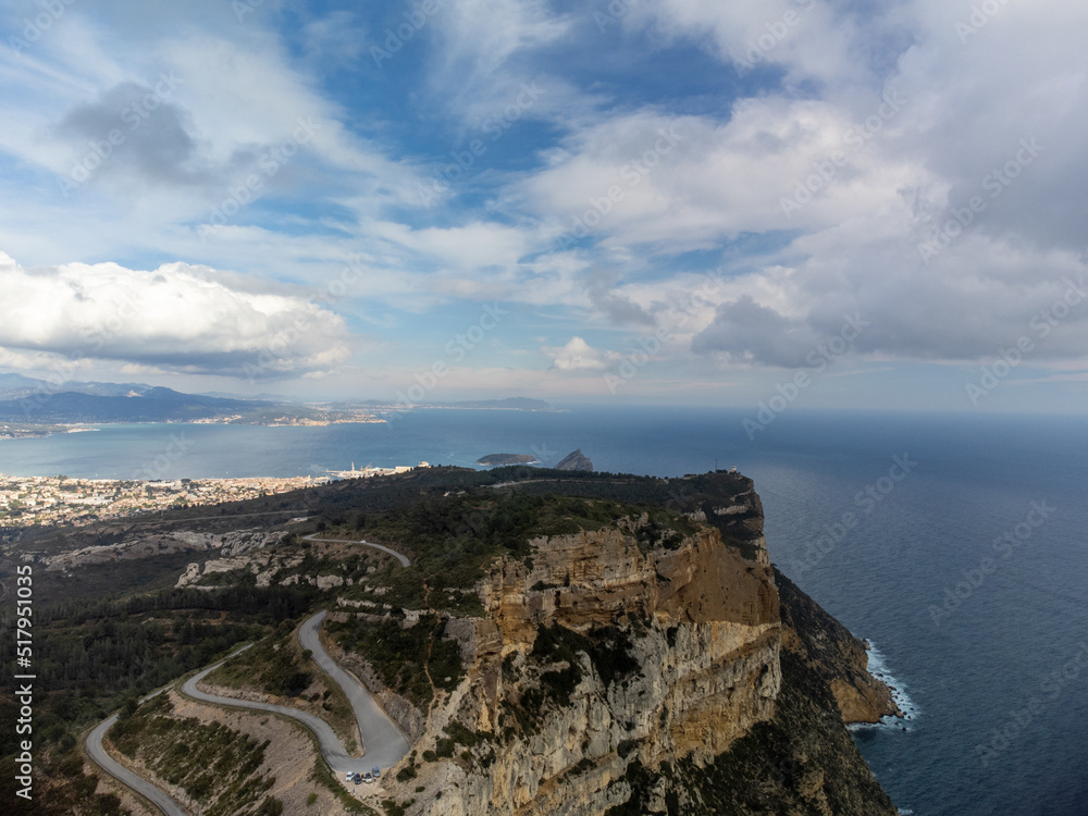 Touristic route D141 road from La Ciotat to Cassis, aerial panoramic view on blue sea, limestone's cliffs and green pine forest, vacation in Provence, France