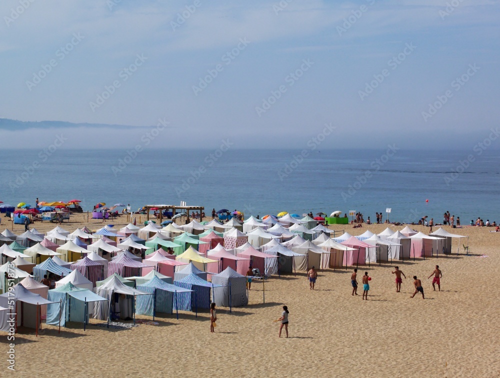 Colorful Nazare beach in the summer time, Centro - Portugal Colorful Nazare beach in the summer time, Centro - Portugal
