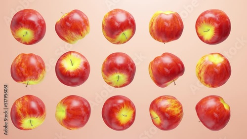 Many bright red apples rotate on a light background.