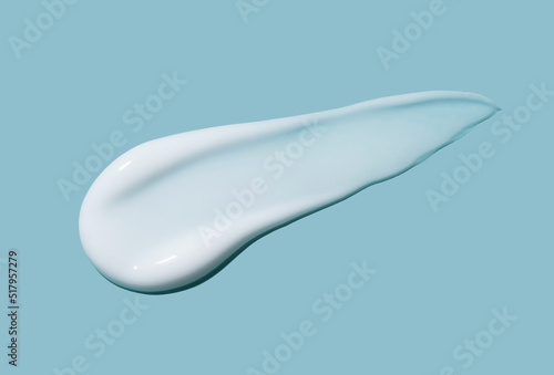 Papier peint White cosmetic cream lotion swatch smear smudge on blue color background