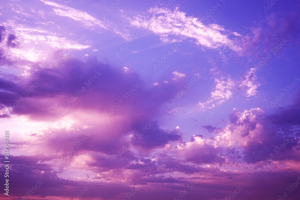 Obraz premium Beautiful purple pink evening sky with clouds view. Colorful sunset background with space for design. Romantic.