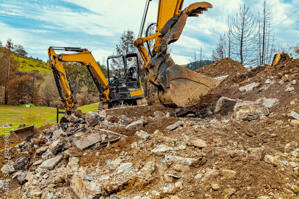 Fototapeta premium Earth, dug up by buckets of excavators. Extraction of minerals in the quarry. Mining industry.