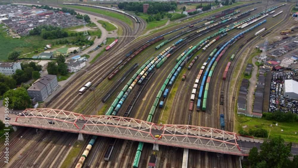 Cars driving on bridge over railroads in city district Cars driving on bridge over railroads in city district