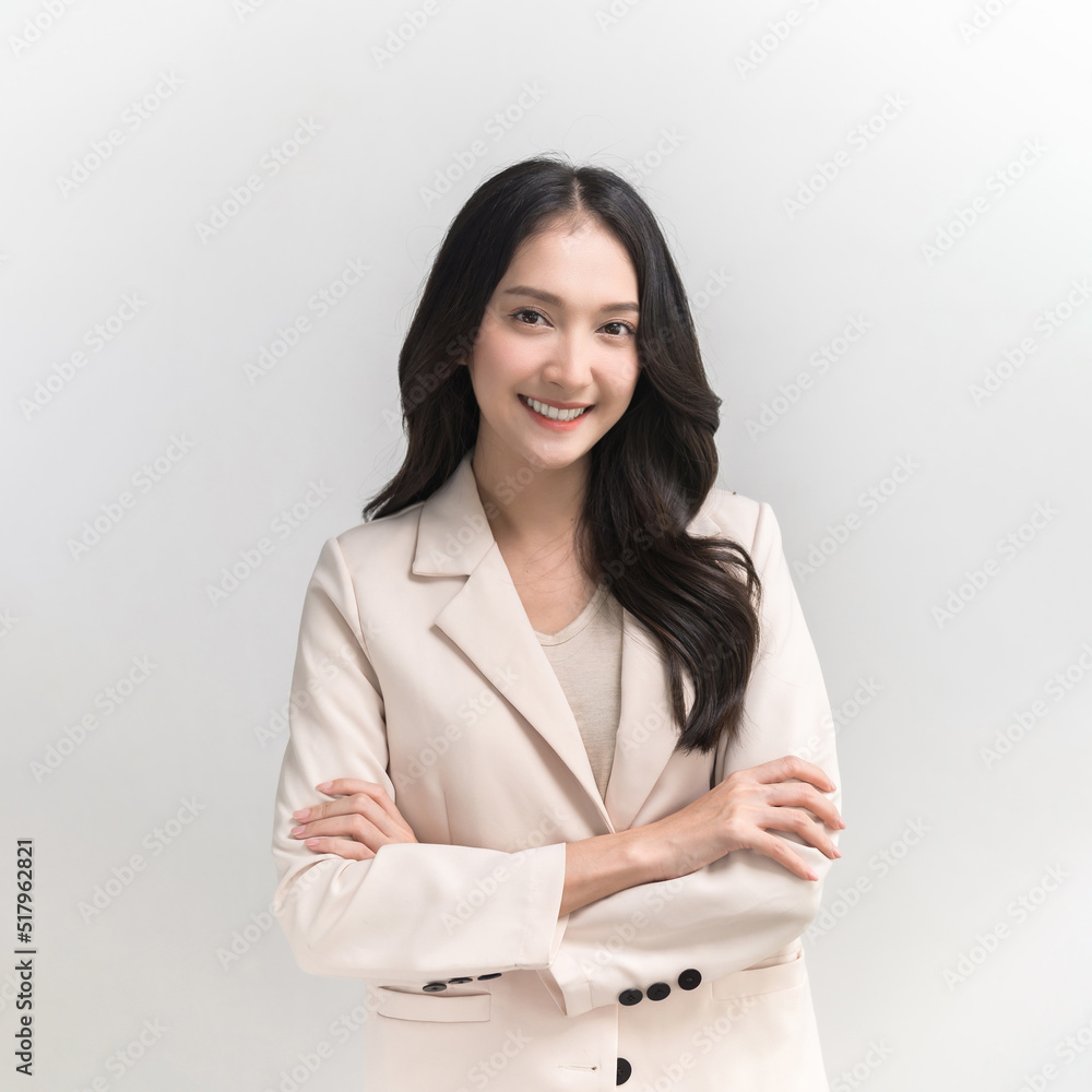 Studio portrait photo of young beautiful Asian woman in formal suit dressing with confident and luxury looking and attractive on white background studio shot. Studio portrait photo of young beautiful Asian woman in formal suit dressing with confident and luxury looking and attractive on white background studio shot.