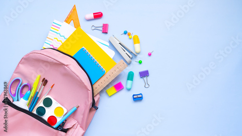 Fotografija Stationery spilling out of a backpack