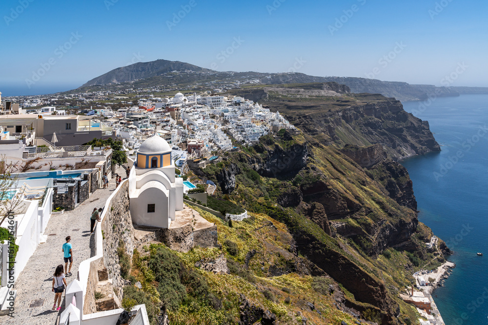 Fototapeta premium Scenic view of Fira, the main town of Santorini, located on the cliffs overlooking the Aegean Sea, Greece