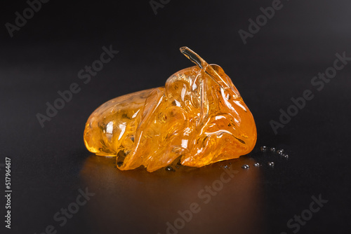 piece of cannabis wax clsoeup. concentrate dab with high thc.