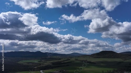 4k Timelapse of Majestic clouds shining through the colorful blue sky