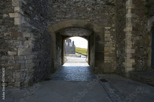Fototapeta Naklejka Na Ścianę i Meble -  A medieval castle entrance or exit protected by a Drawbridge in the UK. 