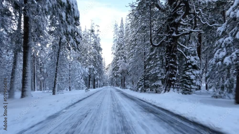 Driving through Yosemite Valley during a snowy winter in Yosemite National Park, California. Driving through Yosemite Valley during a snowy winter in Yosemite National Park, California.