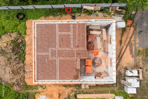 Obraz na płótnie Country house under construction directly above aerial view w salonie