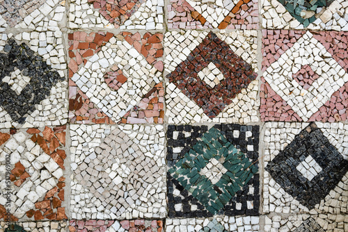 Decorative pebble mosaic. Floor mosaic of colored stones.
