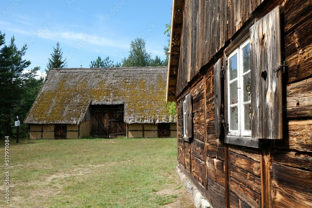 Obraz premium Scenery of wooden cottages in Kashubian countryside, Wdzydze Kiszewskie, Poland