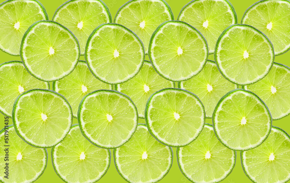 Colorful fruit seamless pattern of fresh lime slices on green background. Trendy sunlight Summer pattern. Minimal summer flat lay food texture, lime sliced background.