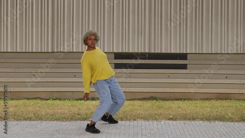 latin girl dancing urban dance in the street