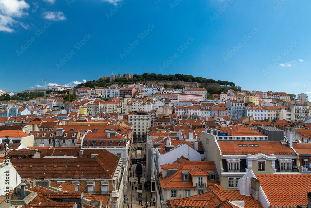 Lisboa, Portugal. April 10, 2022: Alfama neighborhood on a summer afternoon and San Jorge castle.