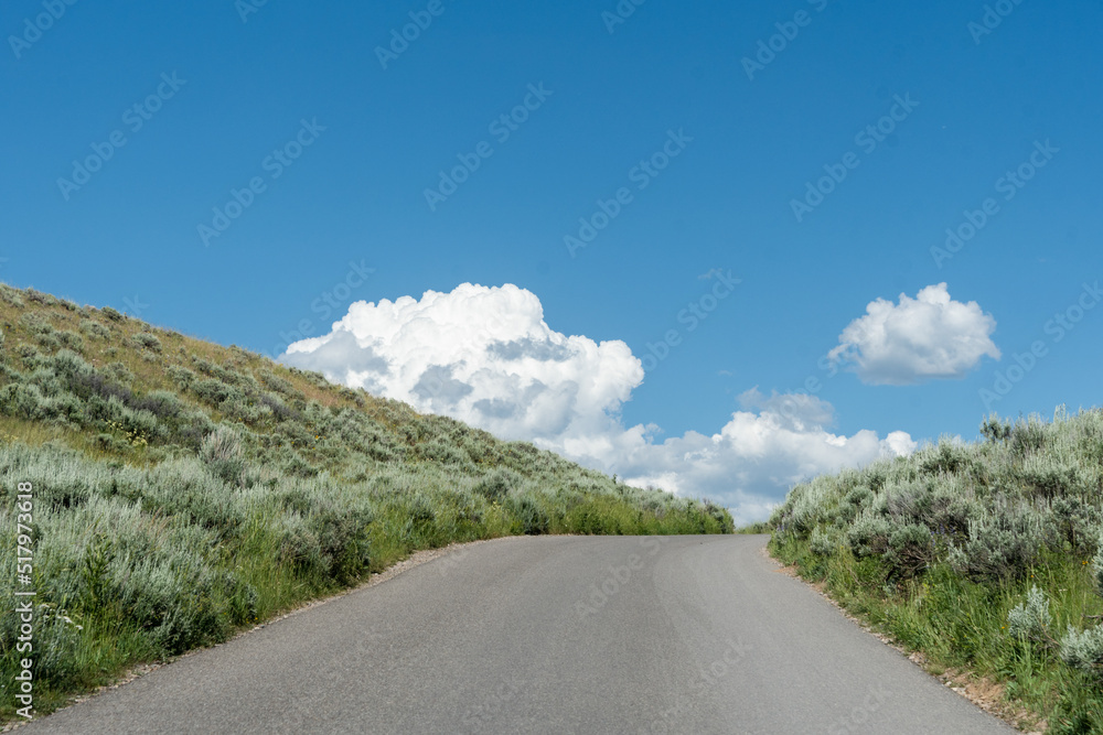Fototapeta premium Cresting the hill after travelling up a winding road.