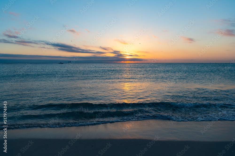 beautiful sunset with pacific water on the summer beach