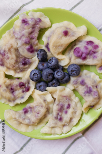 Traditional ukrainian dish varenyky with blueberries photo