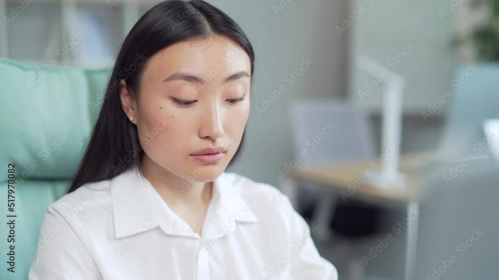 young asian business woman worker employee entrepreneur working on computer laptop sitting at desk at workplace in office. Close up Busy businesswoman in formal shirt using PC. Asia Closeup
