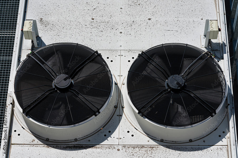 Two large industrial fans on the roof of the production building.
