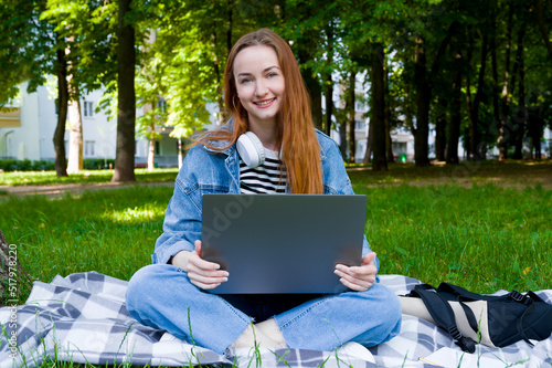 Happy smiling student female using laptop.Back to school concept.Distant Education all over the world