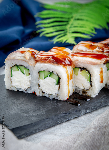 Sushi rolls with shrimp, cream cheese, unagi and tiger prawns. Traditional Japanese cuisine