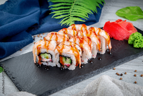 Sushi rolls with shrimp, cream cheese, unagi and tiger prawns. Traditional Japanese cuisine