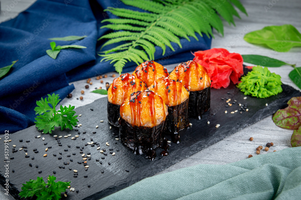 Baked sushi rolls with ayashi cap of crab sauce and unagi sauce