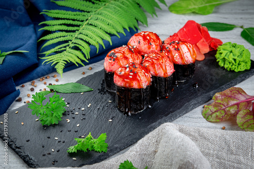 Baked sushi rolls with sesame shrimp cap and unagi sauce. Traditional Japanese Cuisine