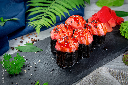 Baked sushi rolls with sesame shrimp cap and unagi sauce. Traditional Japanese Cuisine