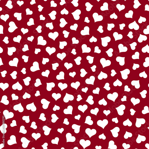 Seamless scattered white hearts in various sizes on red background