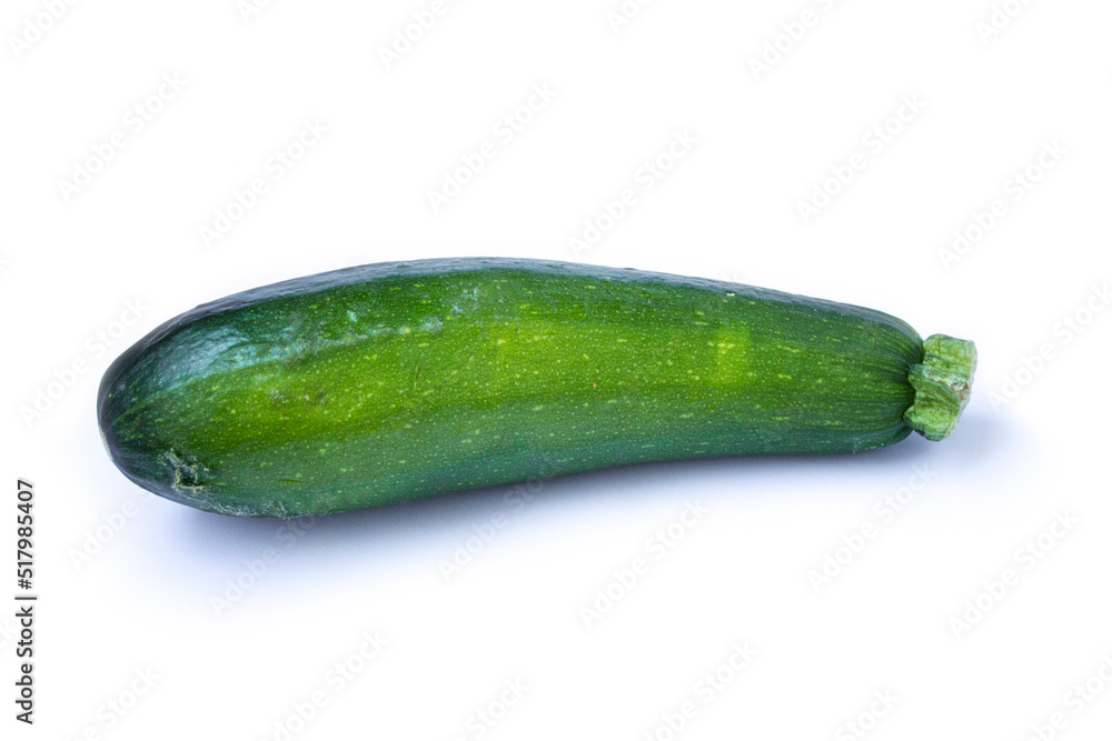 green zucchini lies on a white background green zucchini lies on a white background