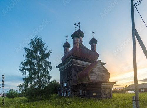 old wooden Christian churches in the Arkhangelsk region in Russia. the concept of travel and tourism photo