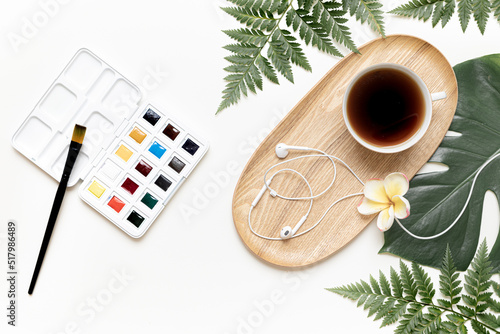 Top view tropical leaves on vibrant background. Summer flat lay composition.