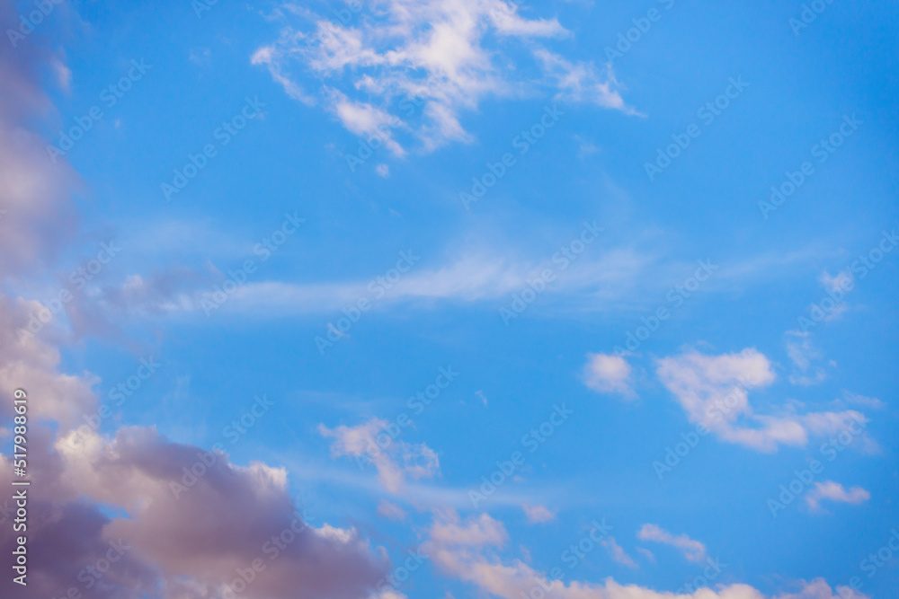 White heap clouds in the blue peaceful sky. The concept of psychological calmness and health. Peace of mind with the forces of nature. Air travel concept.
