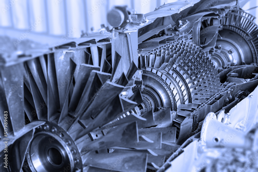 Oblique view of jet engine cross section with a blue tint. Horizontally ...