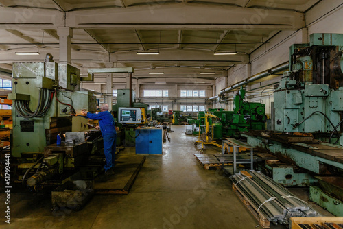 Industrial machine tools inside metalworking workshop