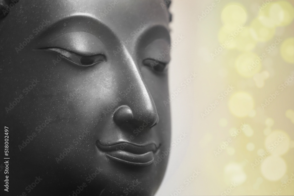  The head of an ancient Buddha statue was made of bronze. image on copy space white background.