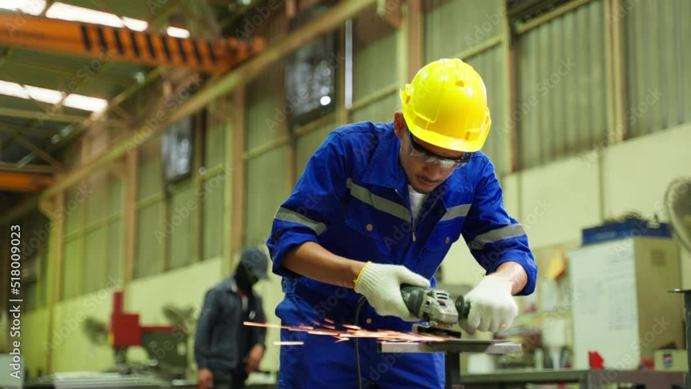 Asian attractive man industrial worker working in manufacturing plant. Asian attractive man industrial worker working in manufacturing plant.