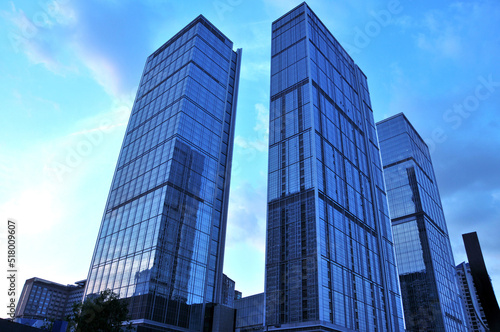 The glass windows of the building in sunset