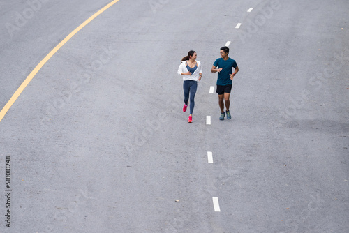 Asian couple, they are jogging and exercising.