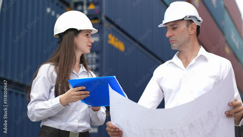 Caucasian business man and woman worker working in container terminal. Caucasian business man and woman worker working in container terminal.