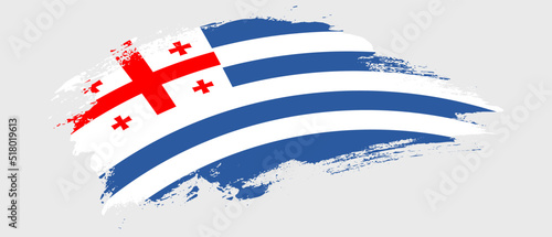 National flag of Adjara with curve stain brush stroke effect on white background