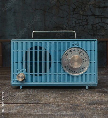 vintage 60's blue transistor radio on wooden table